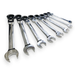 A set of seven chrome combination wrenches in different sizes, arranged diagonally on a plain white background.