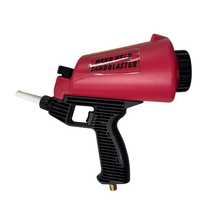 A red and black handheld sandblaster tool with a white nozzle tip, shown on a plain white background.