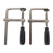 Two metal clamps with black handles on a white background
