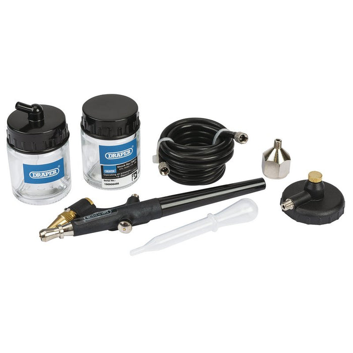 Delaper airbrush kit with various components on a white background