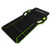 A black NEMESIS folding work mat with bright neon green accents and white logo branding, shown on a solid white background.