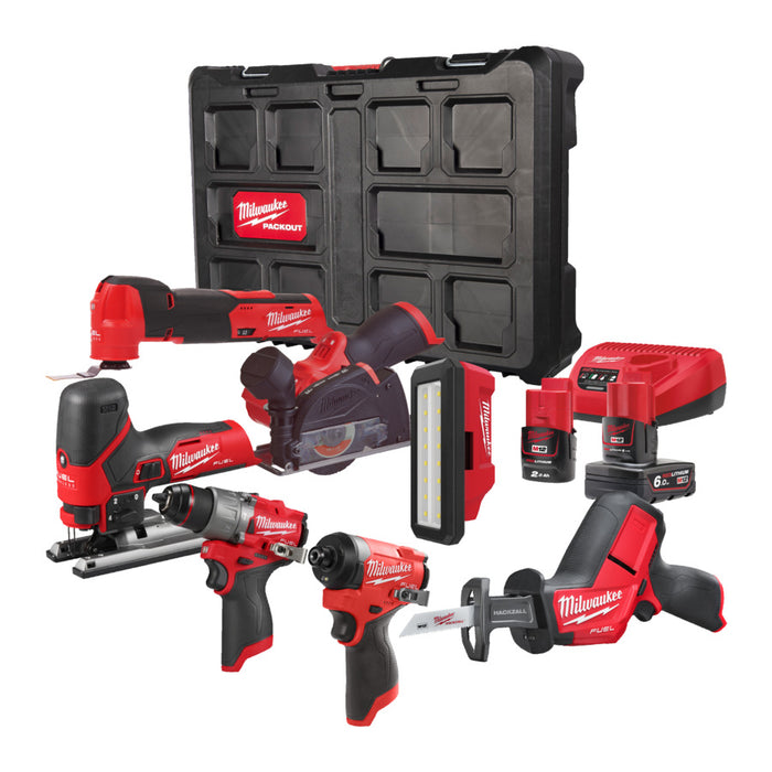 Milwaukee tool set with various power tools and a black carrying case on a white background