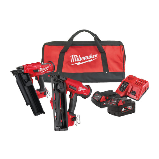 Milwaukee power tool kit with two nail guns, two batteries, and a carrying case on a white background.