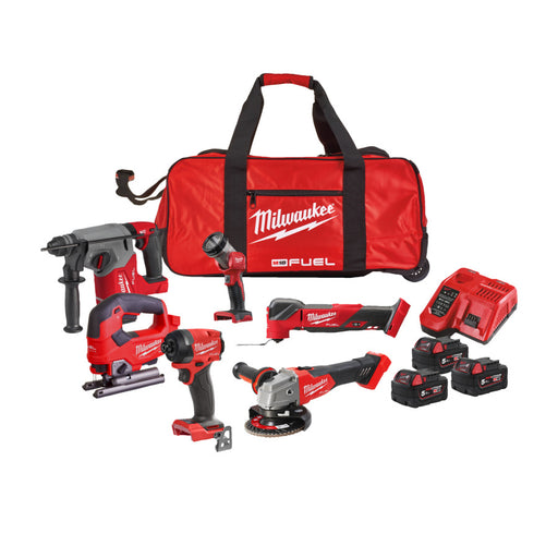 Milwaukee tool kit with various power tools and a red bag on a white background
