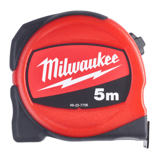 Red Milwaukee tape measure with black label on a white background
